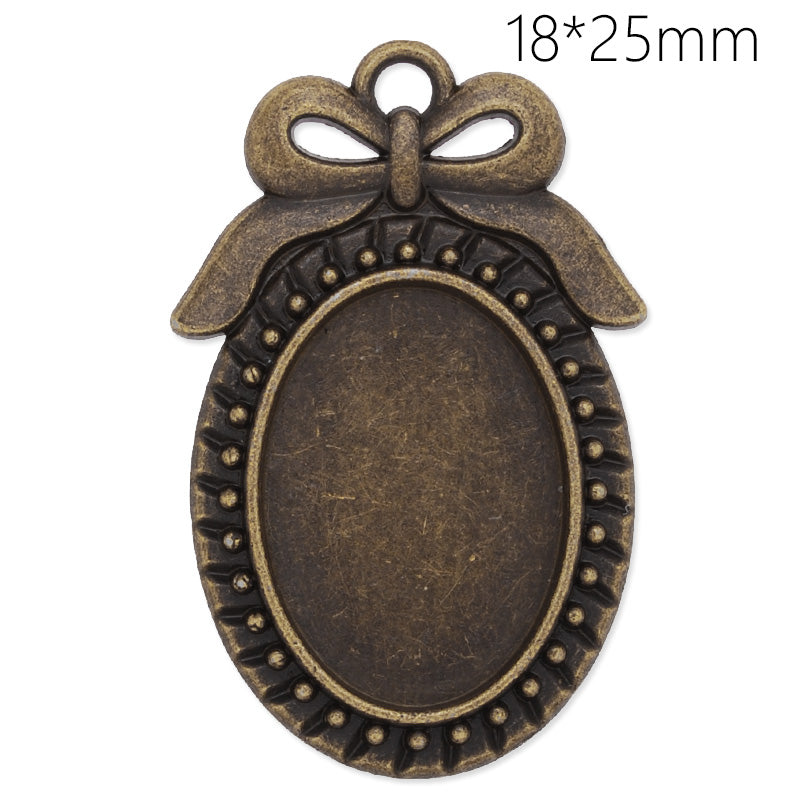 Antique Bronze bowknot pendant tray with 18x25mm oval bezel,20pcs/lot