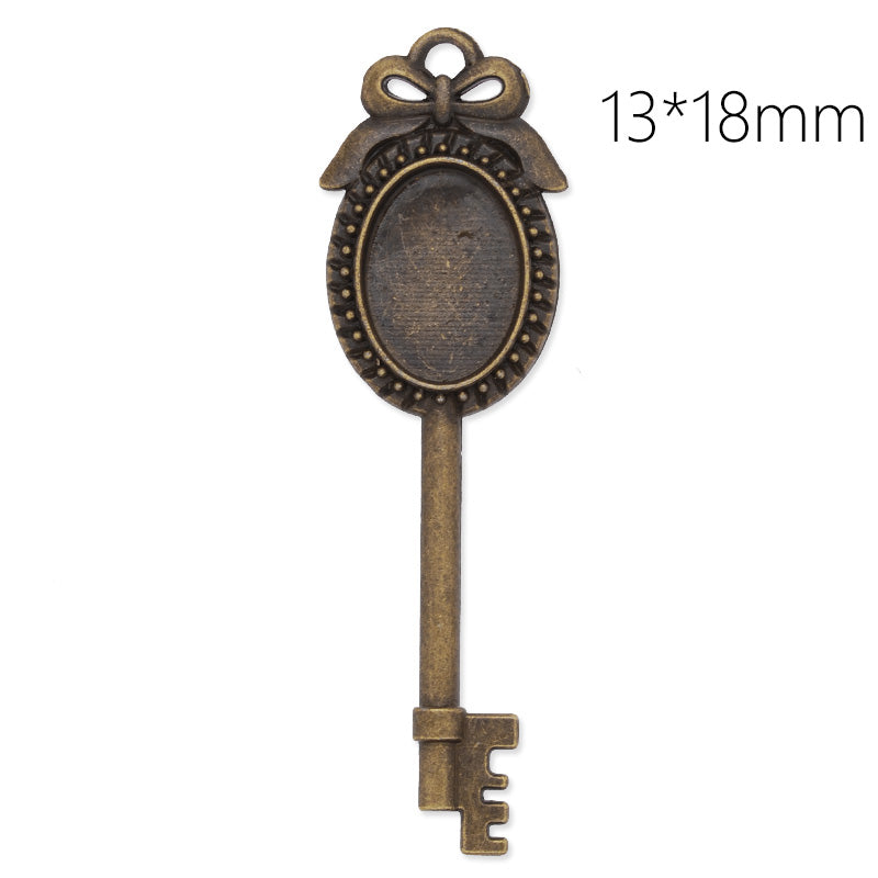 Antique Bronze key pendant tray with 13x18mm oval bezel,length:69mm,10pcs/lot